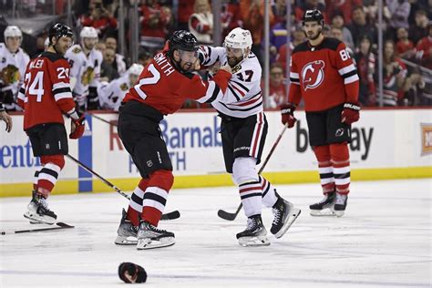 Connor Bedard departs after big hit as Chicago Blackhawks lose 4-2 to New Jersey Devils